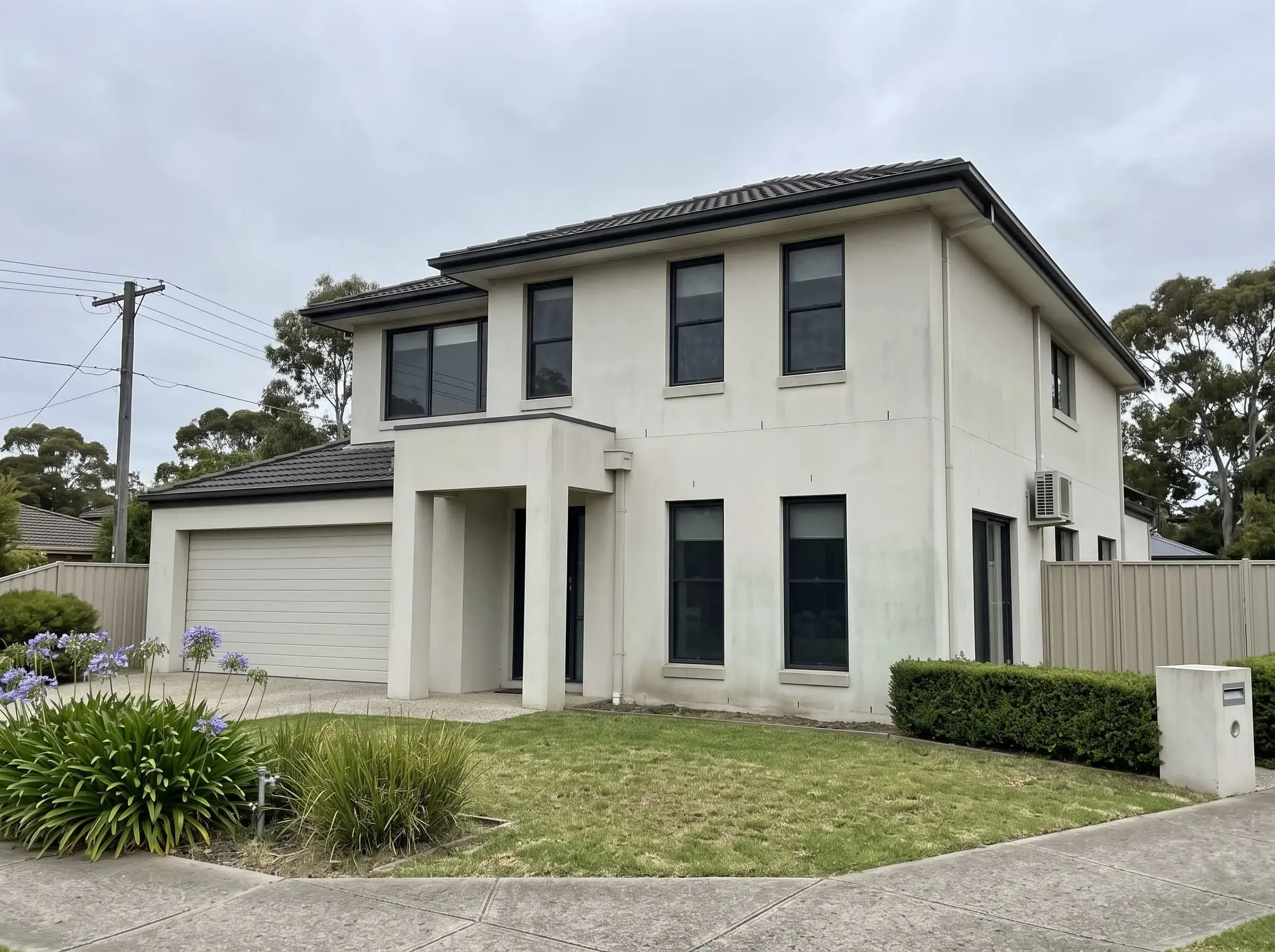 Two-storey render before cleaning in Melbourne south-east